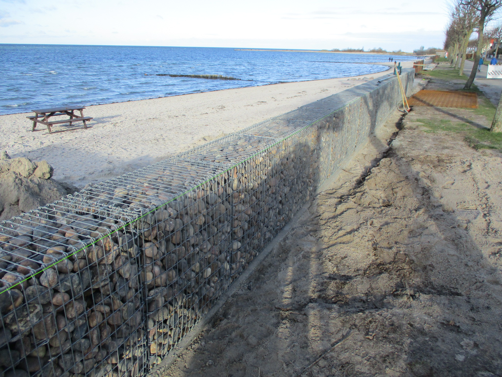 Gabions cure wanderlust stone baskets on the Baltic Sea beach at